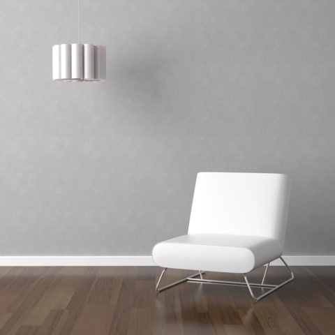 white chair and lamp on grey